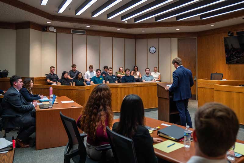 Students in a court room during mock trial class