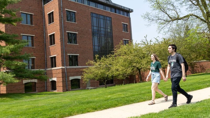 Students walking in front of Ames Library