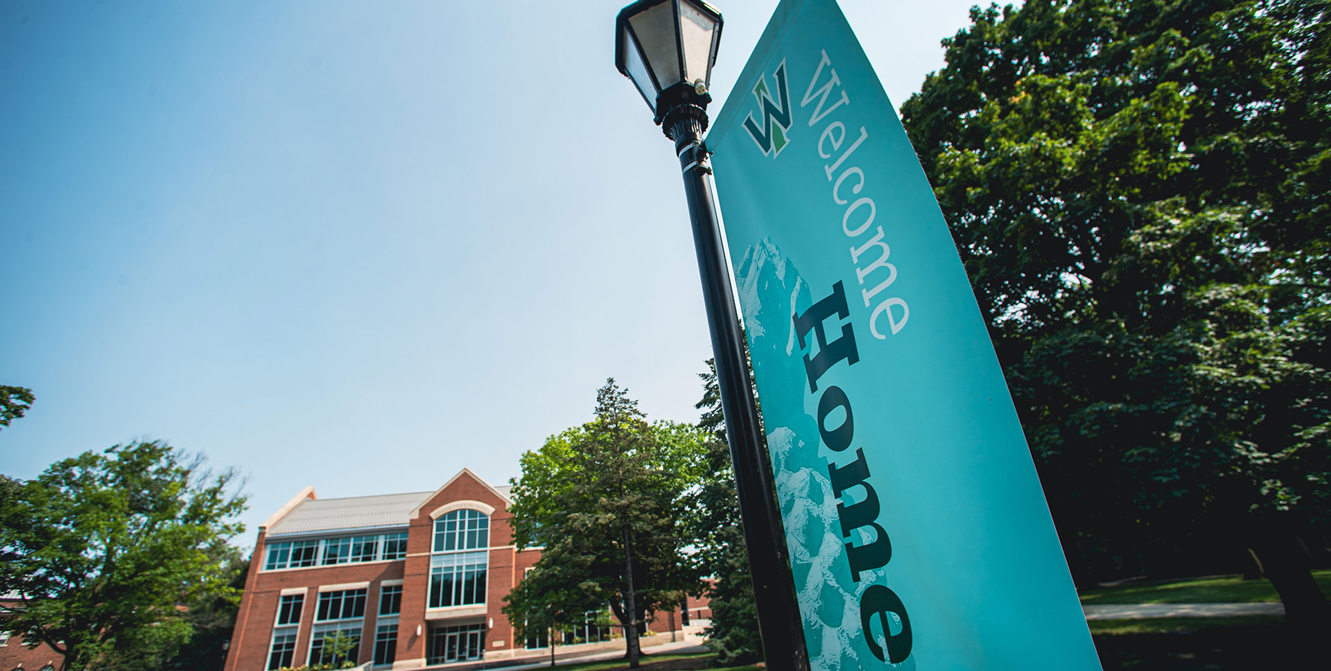 Welcome Home sign in front of State Farm Hall