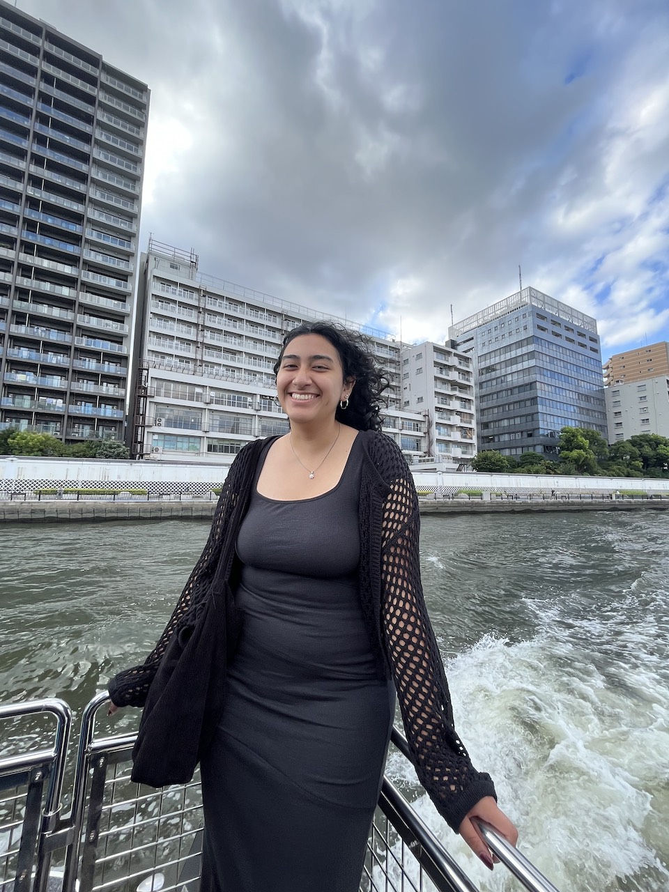 Nathalie Romero with ocean and city landscape in background