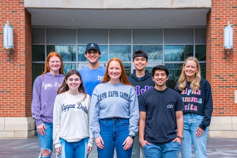 Greek life students on steps of State Farm Hall