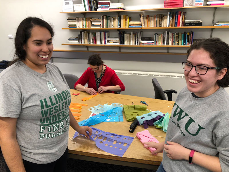 Students making decorations during Day of the Dead celeration.