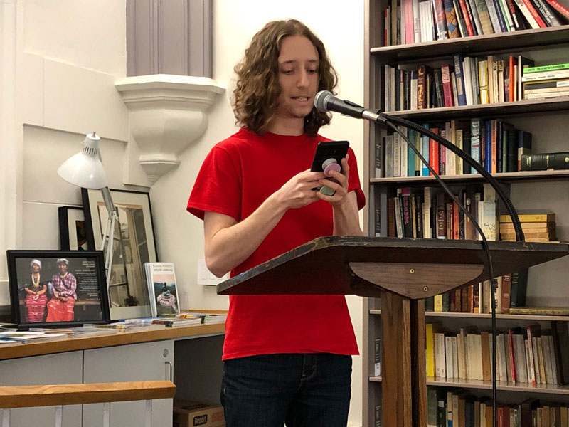 Student reading during World Poetry Day