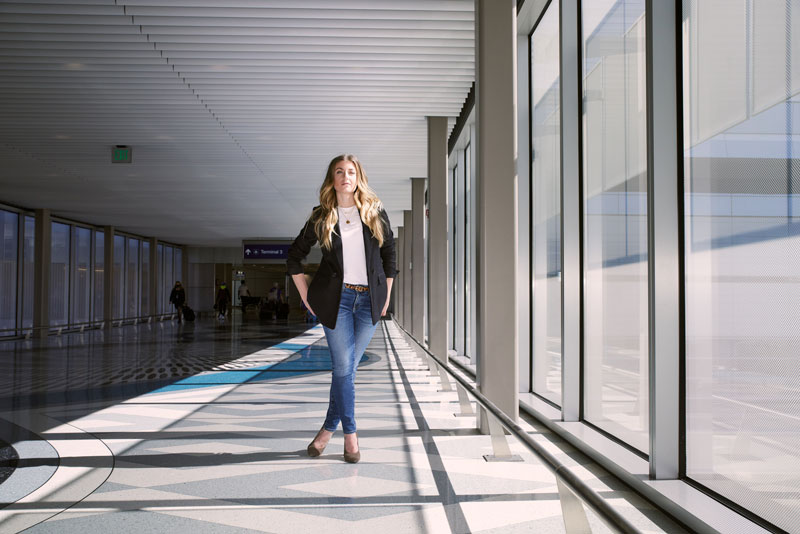 Newman poses in one of the many airport terminals she grew to know well during a decade as a flight attendant.