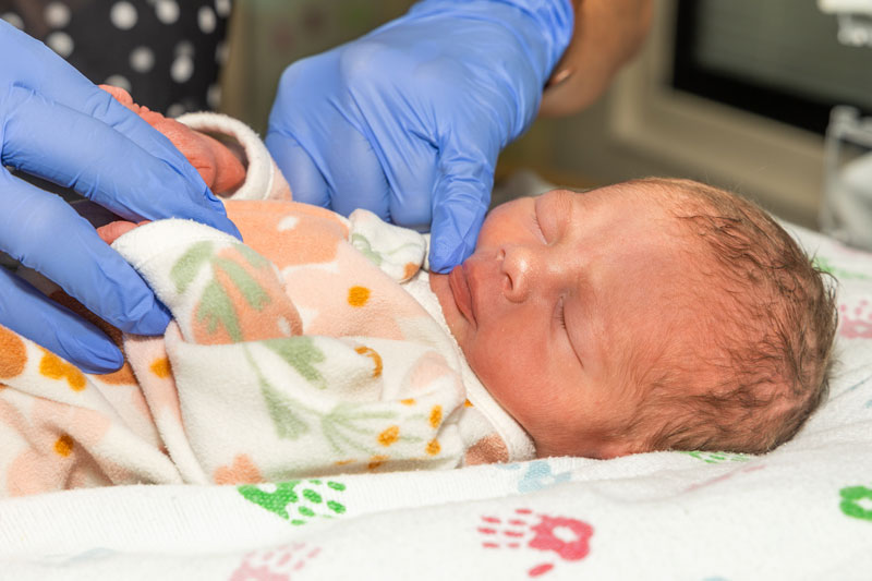 Brenda administers PIOMI to Remi Audeman, a 12-hour old premature infant born at OSF St. Joseph Medical Center in Bloomington. 