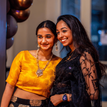 two students pose in hansen student center at the 2024 Unity Gala at Illinois Wesleyan University