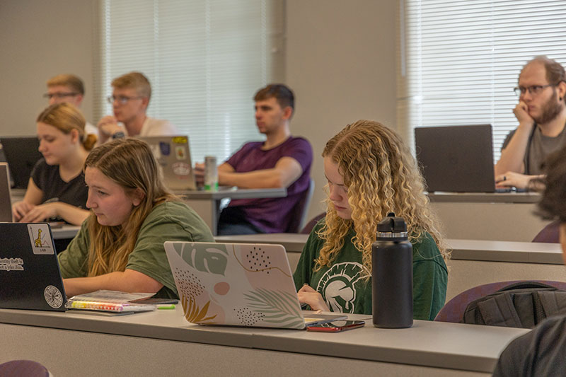 Students taking notes during Nutrition class