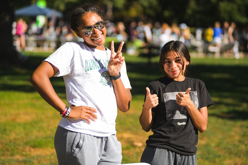 Two students smiling at the camera during the 2023 RSO Fair